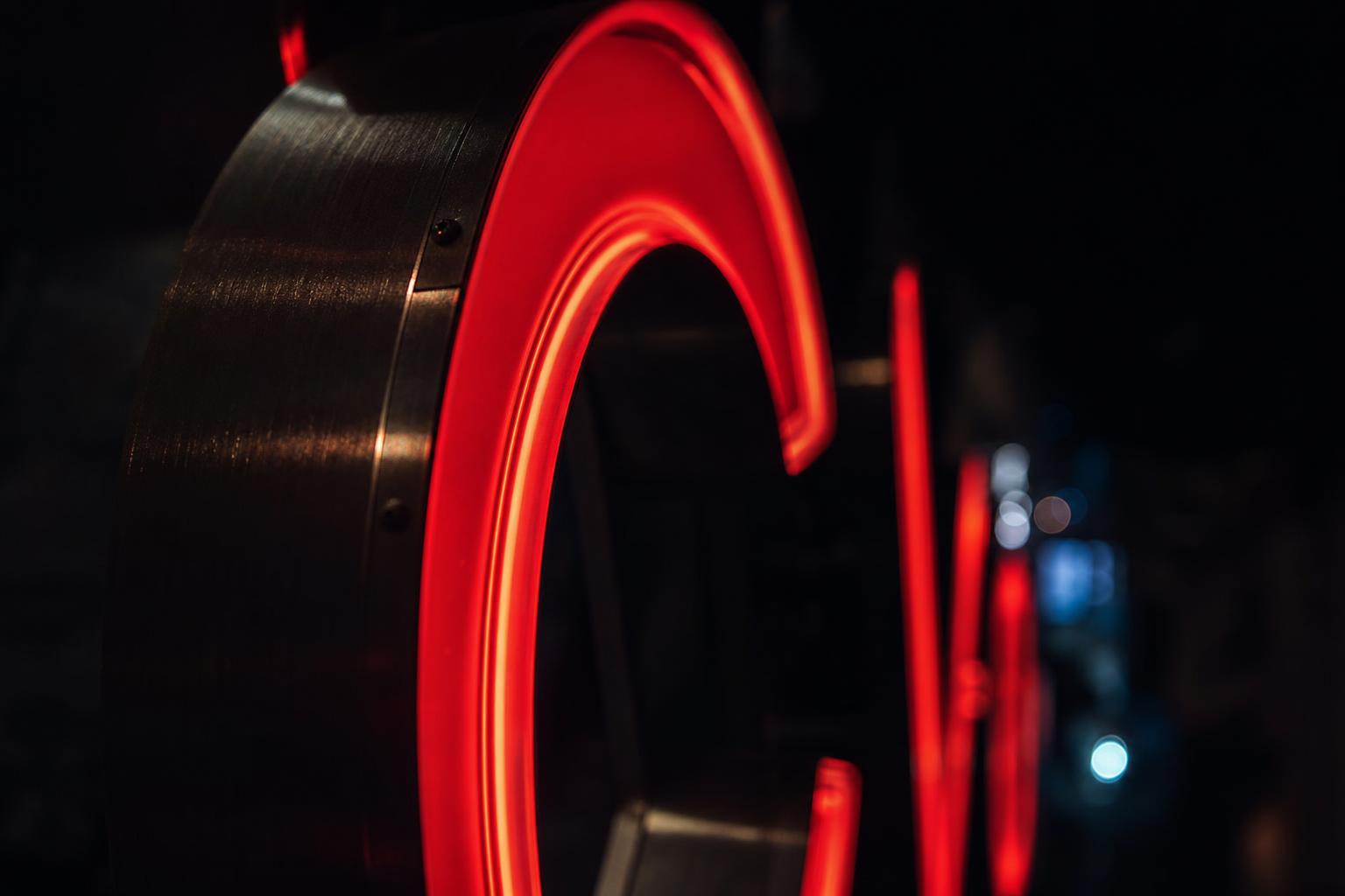 Illuminated SignForge install at dusk